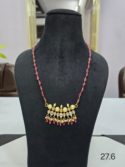 Pendant with red pearls